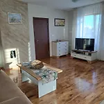 Megi Apartments, Sity